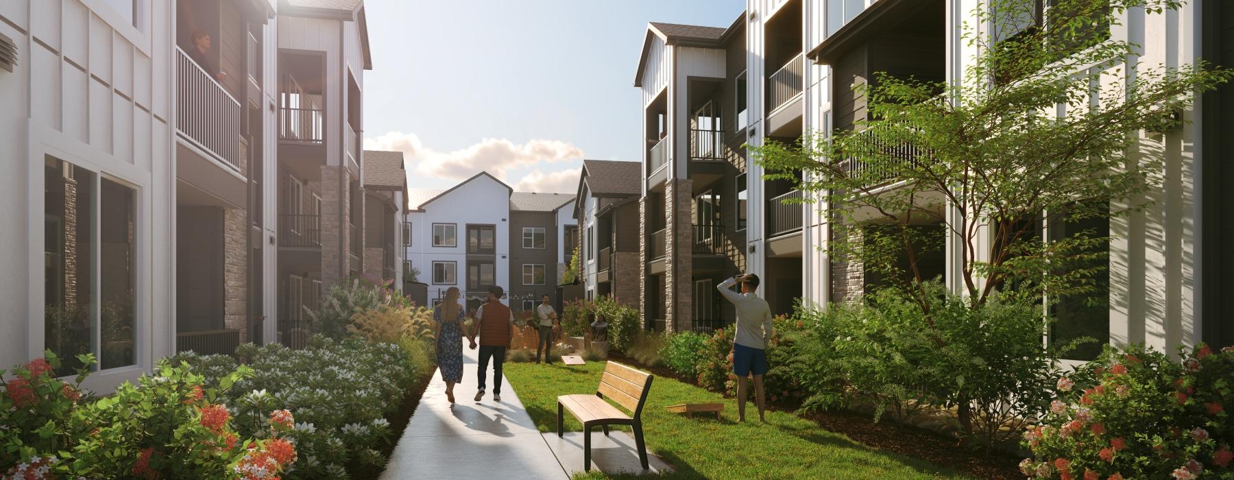 people walking on a path between buildings